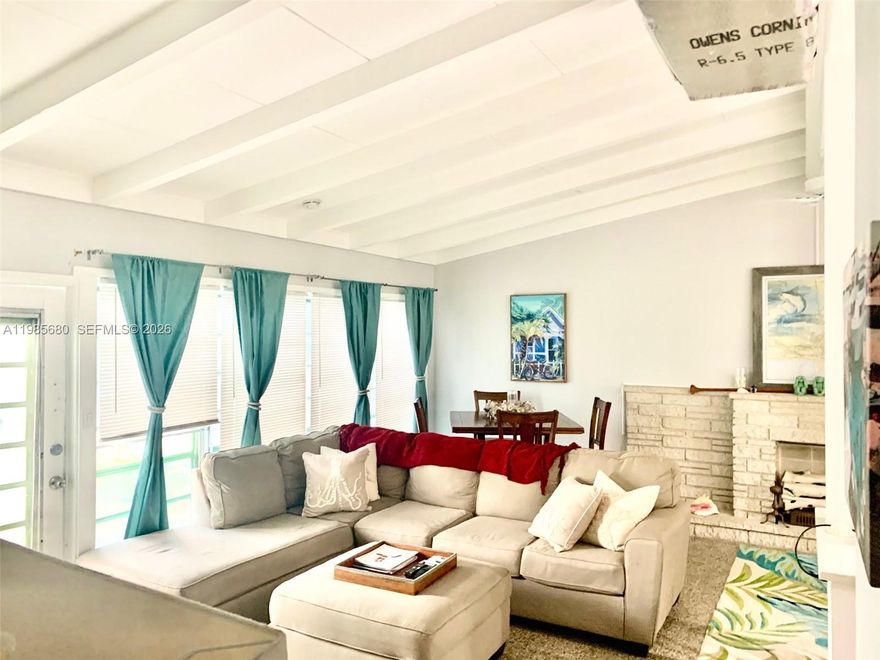 Newly updated  waterfront home with the charm of the 1950’s, but convenience of modern updates.  New a/c, kitchen, appliances, paint, new hot water heater,  and bathrooms, all just a few years old. Tropical  landscaping and multiple coconut palms  with nice outdoor entertaining area overlooking the waterfront, allow you to enjoy lazy days relaxing or entertaining your friends and family.