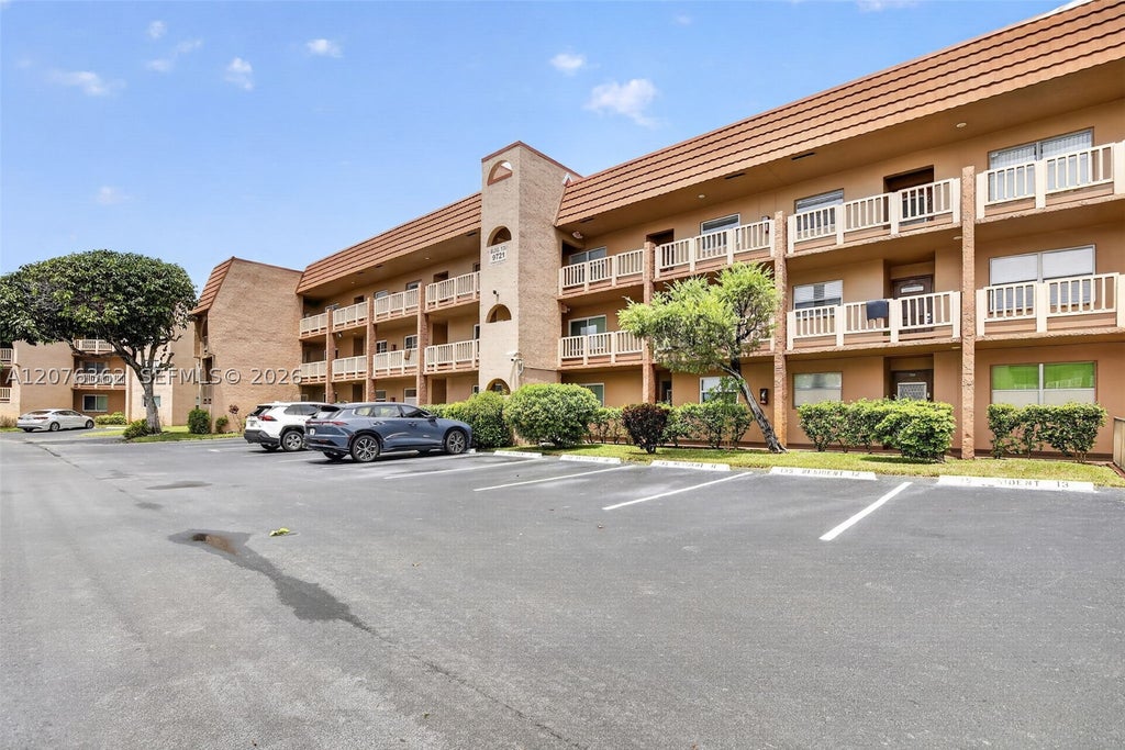 Photo of 9721 Sunrise Lakes Blvd #102, Sunrise, FL 33322 (MLS # A12076362)
