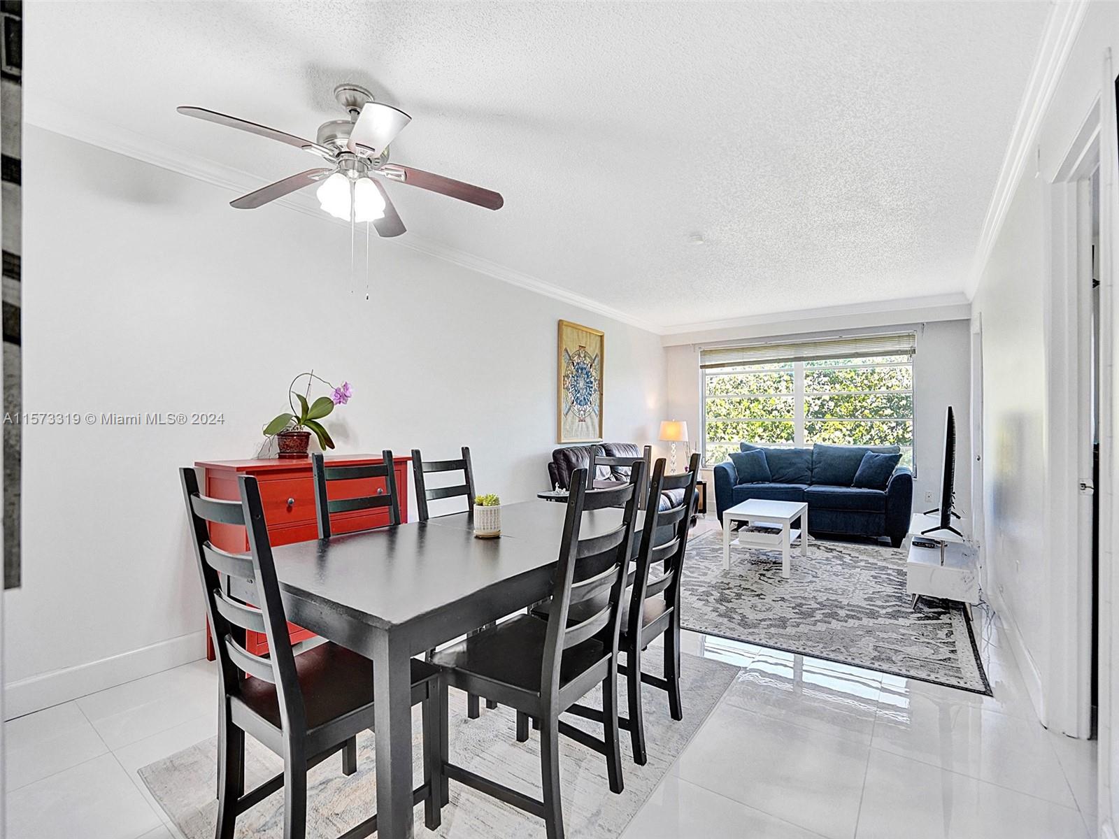 Step Inside this contemporary remodeled 2 bed/2 bath CORNER unit at Omega Condos. Features white kitchen cabinets, quartz counter tops and sleek white porcelain floors. A/C replaced 2020. Retreat to your generously sized primary bedroom, easily designed to fit a king sized bed, large walk-in closet + Ensuite. Second bedroom offers ample space too. Entertain on your screened in patio overlooking the courtyard. Full size washer/dryer in unit & Rolladen hurricane shutters on patio for peace of mind. Comes with 1 Assigned parking space. Building has an Elevator. HOA includes: Water, cable, roof, Insurance, landscape, paint, pool, gym, club house, Tennis. No rentals first year of ownership, Min 650 credit score. 40 yr. inspection completed. Close to shopping, restaurants & major highways.