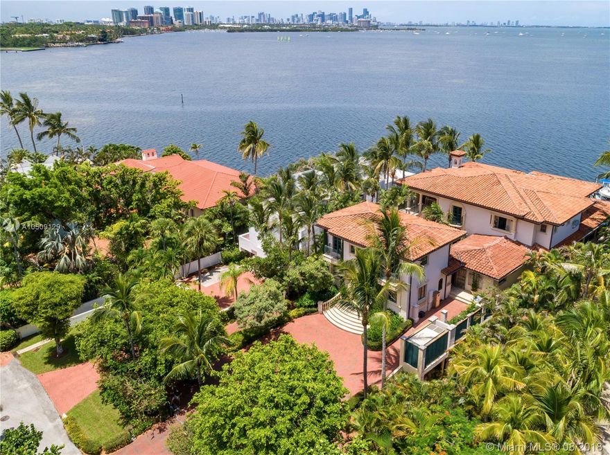 This Bayfront Tuscan villa with a modern interior flare is surrounded by expansive views of Biscayne Bay and Miami’s Skyline! The elegant courtyard entrance reveals classic architecture with an open layout filled with natural bright light. This spectacular home is made for entertainment with a large chef’s kitchen, bar area and an impressive 2,000 bottle temperature-controlled wine cellar. Custom-built home, 17ft above sea level with 100ft of water frontage. Oversized master with dual closets, wet bar & luxurious bath. Meticulously finished with honed marble & porcelain floors, LED lighting & surround sound system throughout. Elevator, impact glass, full house generator & 2 guest cottages. Minutes away from elite schools, Coconut Grove, Brickell, Downtown & Miami Beach. SF as per floorplan