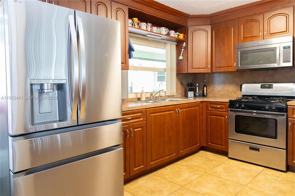 Photo of 9161 NW 26th Pl, Sunrise, FL 33322 (MLS # A11962461)