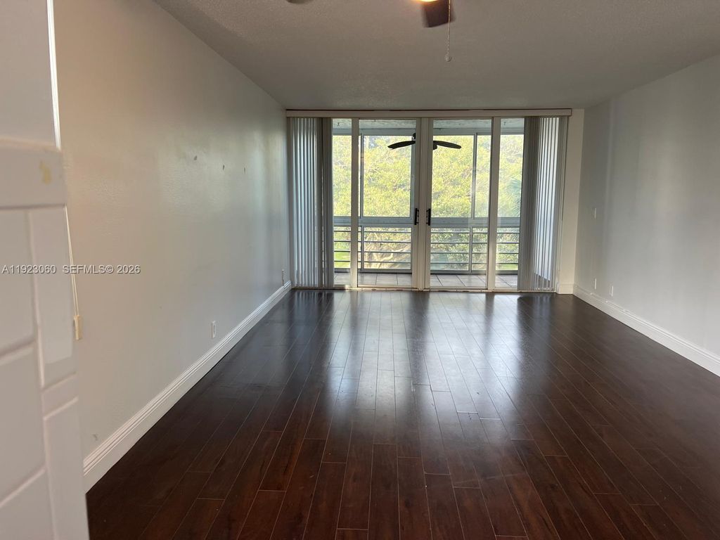 Photo of 9441 Evergreen Pl #301, Davie, FL 33324 (MLS # A11923060)