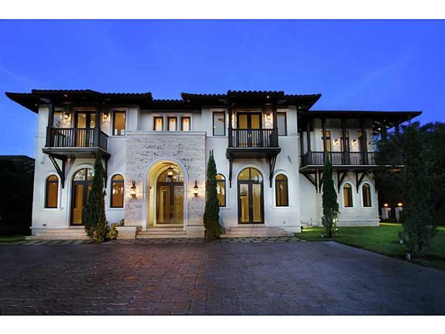 Enjoy impeccable high end finishes in this expansive 8BD/9 + 1BA 11,400 SF custom home by Pioneer Inter-Development. The formal entry leads to a winding staircase, wine cellar, elevator, library/office & open kitchen/family room. Marvel in Venetian plaste r walls, vaulted ceilings, intricate marble/stone details & views  to the pool, spa & lushly manicured grounds. Contemporary home comprised of 2 marvelous master suites and 5 en-suite bedrooms w/ walk in closets. Close to Pinecrest Elementary & A+ schools