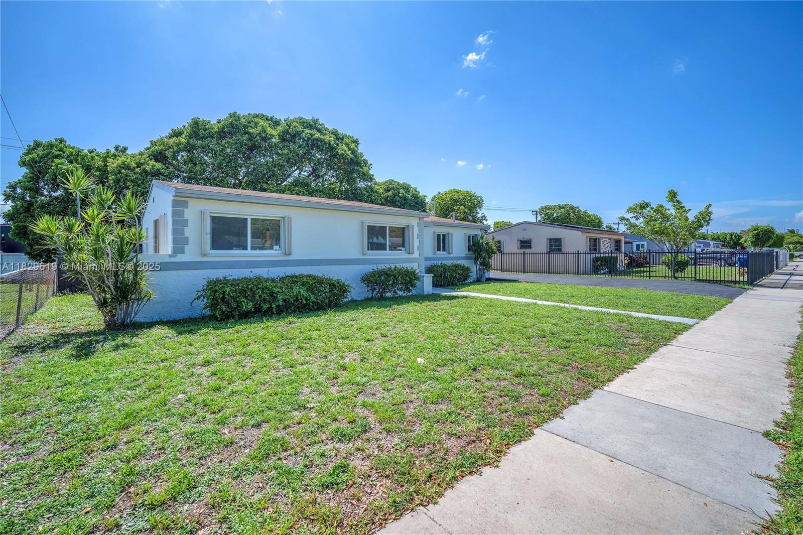 Beautifully renovated 3-bedroom, 2-bath home featuring a brand-new AC system, updated insulation, natural gas, new ducts for optimal comfort, and so much more. Enjoy outdoor living on the spacious terrace or in the large, private backyard—no rear neighbors and plenty of room for a pool. Located on a quiet street with a generous driveway, this home offers easy access to major highways and public transit, and is just minutes from Hard Rock Stadium, shopping, and dining. A perfect blend of comfort and convenience!