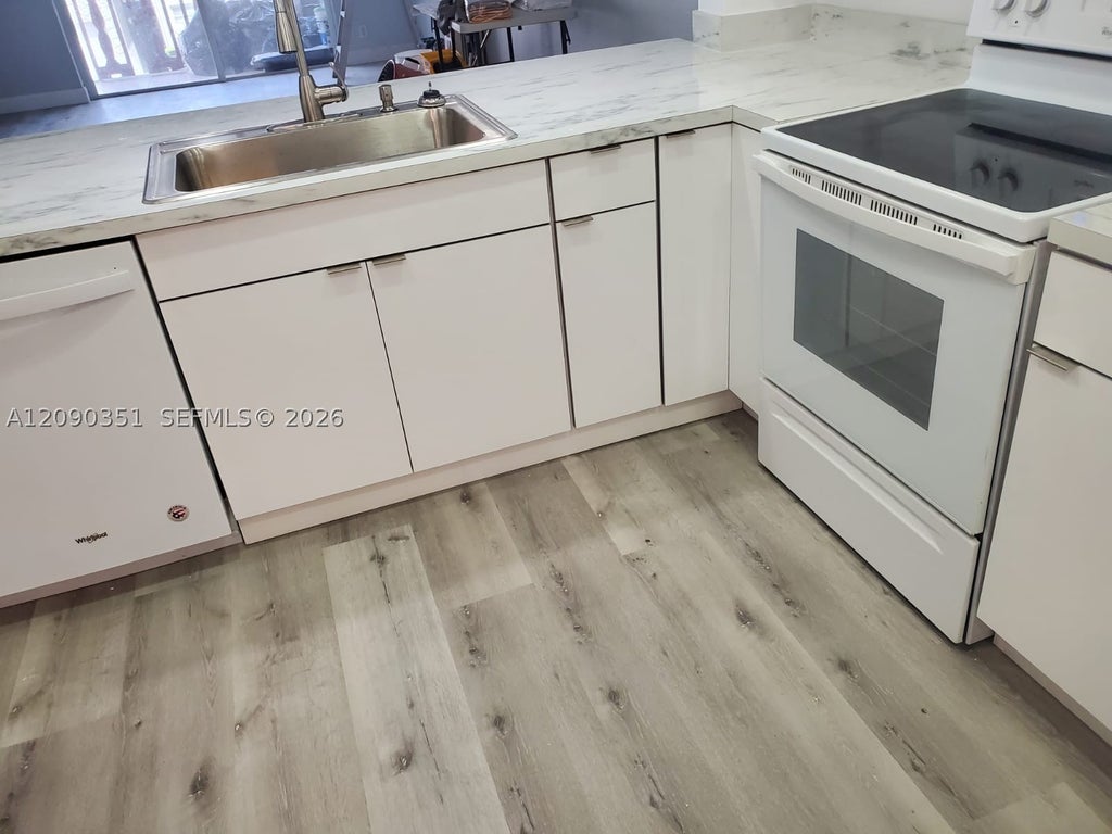 Photo of 215 SE 3rd Ave #206D, Hallandale Beach, FL 33009 (MLS # A12090351)