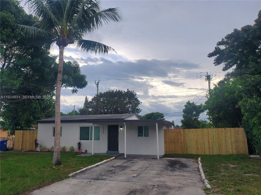 Beautifully renovated 3+ bedroom, 1-bath home in a prime Pompano Beach location—just minutes from the beach, major highways, shopping, and dining. This move-in-ready property features tile flooring throughout, fresh interior paint, modern lighting, and an upgraded bathroom. The kitchen offers refreshed cabinetry, and the home includes a full-size stacked washer and dryer along with a tankless water heater. Impact windows installed. 
A spacious laundry room provides additional versatility—perfect for a home office, play area, or extra storage. Outside, enjoy a private fenced yard that wraps around the home with ample space to park a trailer, truck, or recreational vehicle.
A perfect rental for those seeking a well-maintained, centrally located home close to everything Pompano Beach has to offer.