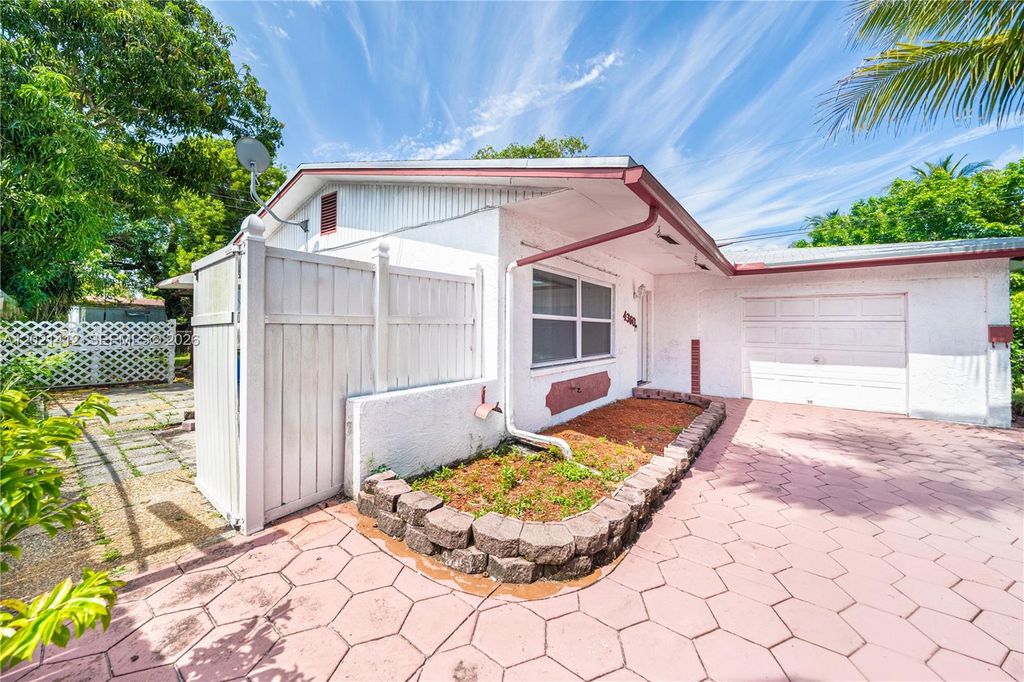 Photo of 4360 NW 32nd Ct, Lauderdale Lakes, FL 33319 (MLS # A12021412)