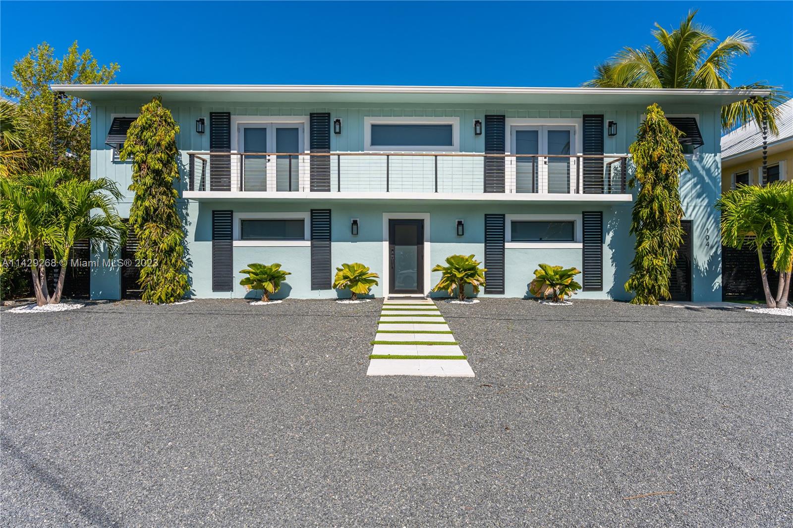 Nestled along the water's edge, this exquisite 4-bedroom, 4-bath waterfront residence seamlessly combines elegant living spaces with breathtaking natural beauty. Property includes a Boat Lift with a water frontage of 75 ft., four spacious bedrooms, each offering its own private retreat, and four well-appointed bathrooms, this home ensures comfort and convenience for every member of the household. Impact Sliding Glass Doors & Windows thru out the entire home! Poolside Kitchen, Range, Sink & Wine Cooler w/Bonus Rm on side of home. Great for families & guests!