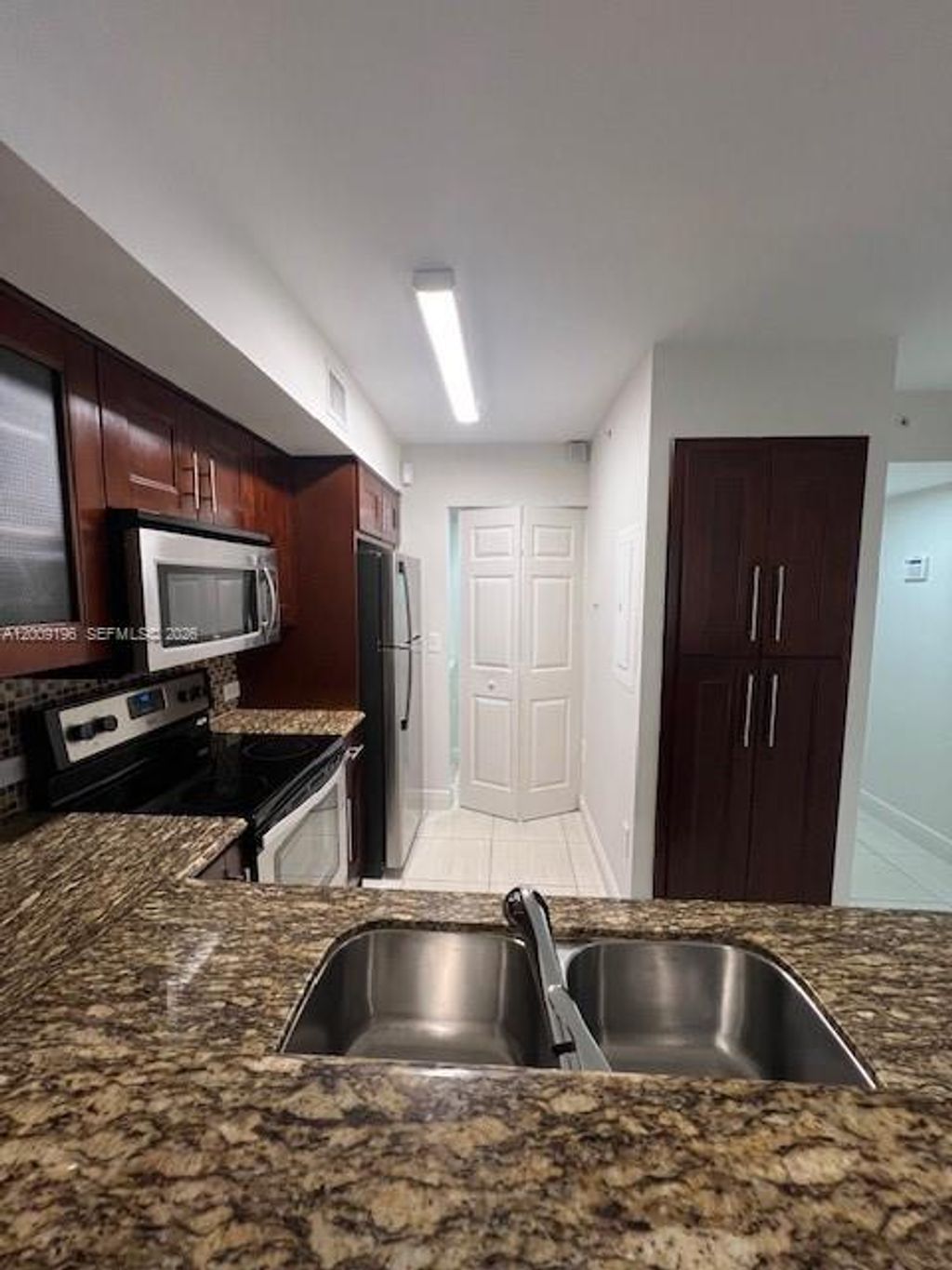 Photo of 520 SW 111th Ave #101, Pembroke Pines, FL 33025 (MLS # A12009196)