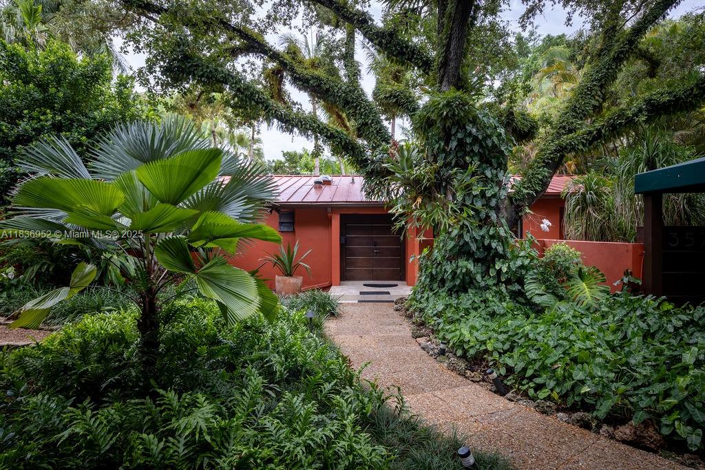 Tucked away in the heart of Coconut Grove sitting in 14,000 sqft of property we find this Mediterranean jewel surrounded by a tropical paradise. Luminous and spacious, delightful views of gardens and pool are seen from virtually every room. 3B/2.5Ba, living room + den, dining area, family room, studio/office, eat-in kitchen.
Architecturally designed ample open spaces with all Italian furnishings. Abundant outdoor spaces, with a living and dining deck great for entertaining, a master room deck with magnificent views of lush greenery and pool, and a quiet corner covered "Bali" deck great for a quiet evening, meditating or simply relaxing, in addition to beautiful stone paved pathways full of flowers, palm trees, heliconia, croton, bougainvillea and a vast number of exotic plants