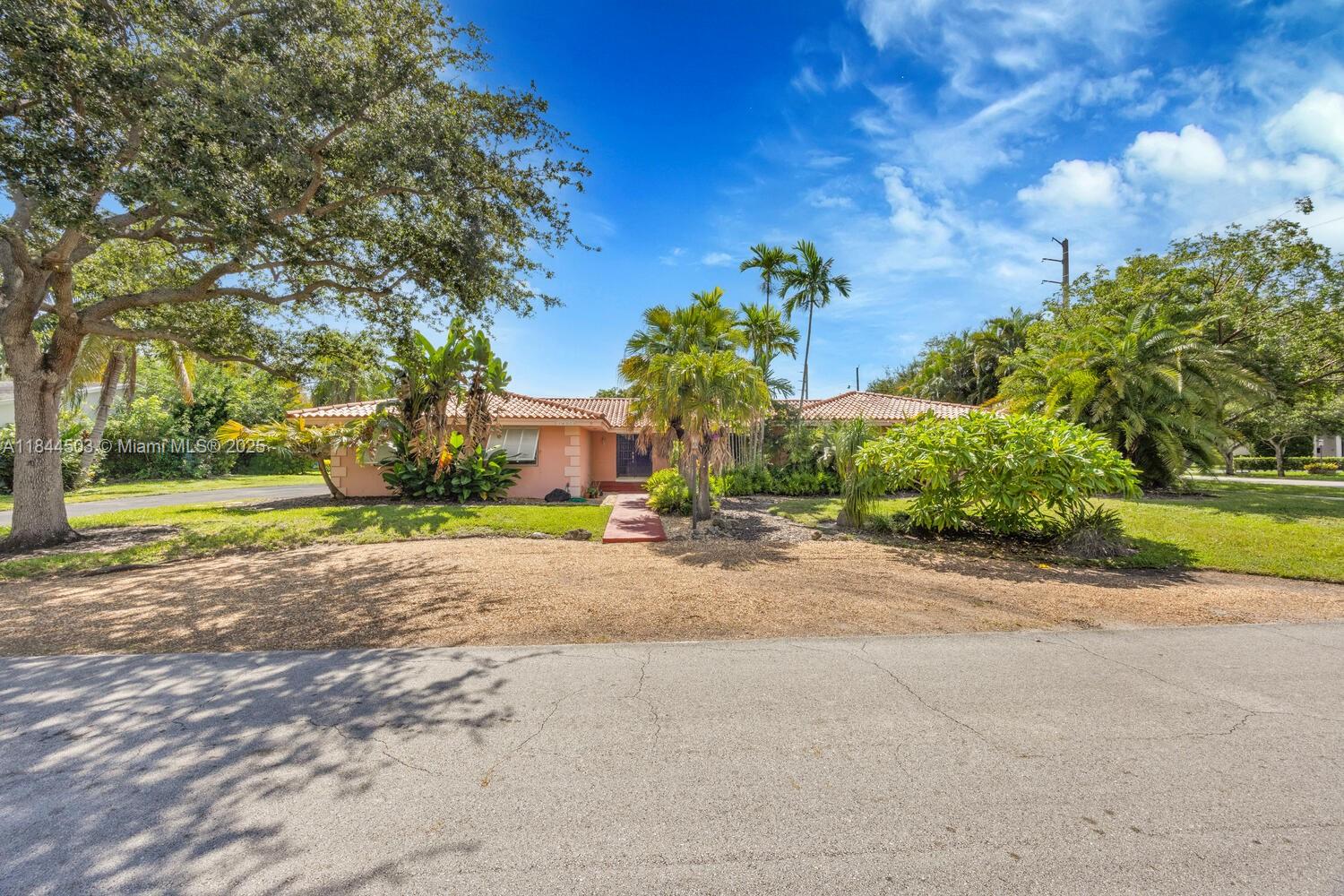 Opportunity Knocks in North Palmetto Bay! This spacious 5-Bedroom + Den, 4-Bath home (3 ensuite) offers 4,336 SF under roof—perfect for multi-generational living. A true Diamond in the Rough, ready for your personal touch! The living room overlooks a screened pool & patio, while the kitchen opens to a family room. Den is currently used as a kitchenette in the bedroom wing. Garage converted to oversized Florida room plus a separate laundry area. Situated on a generous corner lot with 19,250 square feet with plenty of room for your boat, RV and other toys. Abundant fruit trees and mature foliage.