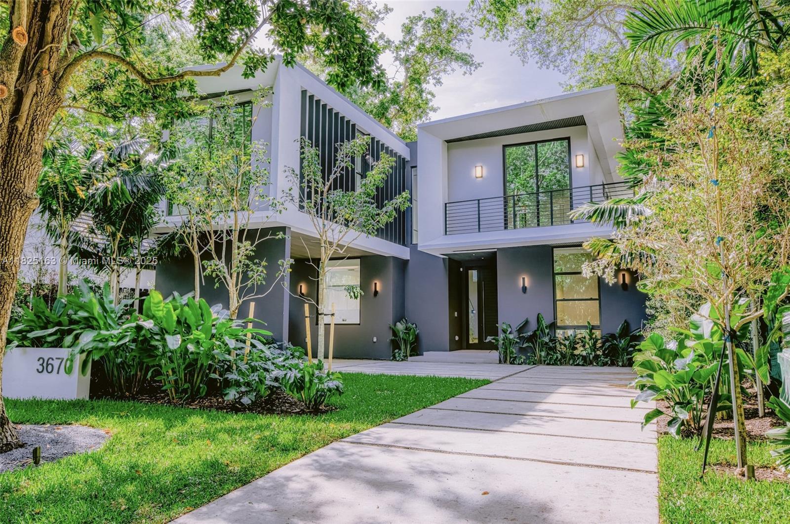 Nestled in the vibrant Coconut Grove neighborhood of Miami, this home offers a blend of modern luxury and tropical charm. Featuring 5 bedrooms and 5.5 bathrooms at 4,052 square feet, providing ample space for luxurious living. This meticulously crafted residence boasts spacious interiors, featuring elegant finishes and high-end appliances. The northern exposure fills the home with natural light, creating a warm and inviting ambiance throughout. The gourmet kitchen boasts state-of-the-art appliances, while the luxurious master suite features a spa-like ensuite bath an A+ master closet. The outdoor area is an entertainer's paradise, with a below-ground pool, patio and artificial turf for low-maintenance and ideal for hosting gatherings or simply enjoying the beautiful Miami weather.