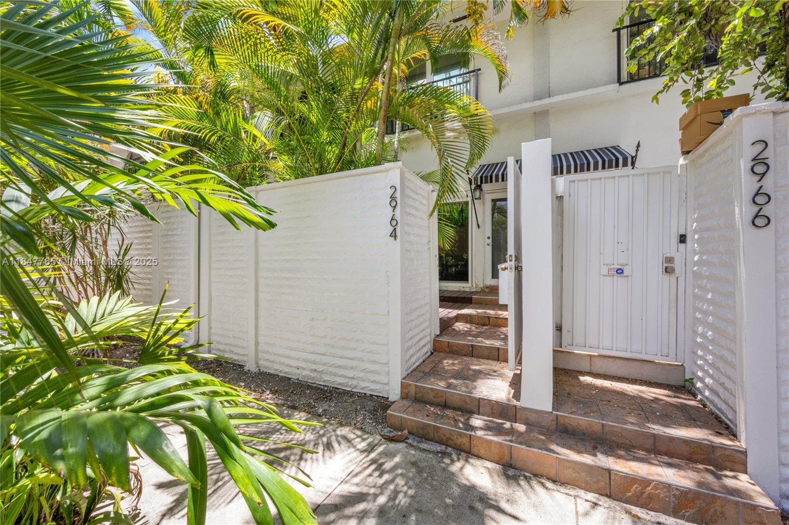 Walk, bike, or scooter to everything from this ideally located Coconut Grove townhome in the lushly landscaped Peppertree Village. This rarely available residence features polished terracotta floors, updated bathrooms, and a beautifully remodeled kitchen with stainless steel appliances and ample counter space. The gated community includes a serene pool area surrounded by tropical foliage, offering a quiet retreat in the heart of the Grove. Just steps away, enjoy all that Coconut Grove has to offer, including the newly reimagined Cocowalk, waterfront parks, marinas, coffee shops, and some of the area’s best restaurants. Furniture is available for purchase, but artwork is not included. Available for occupancy starting August 11.
