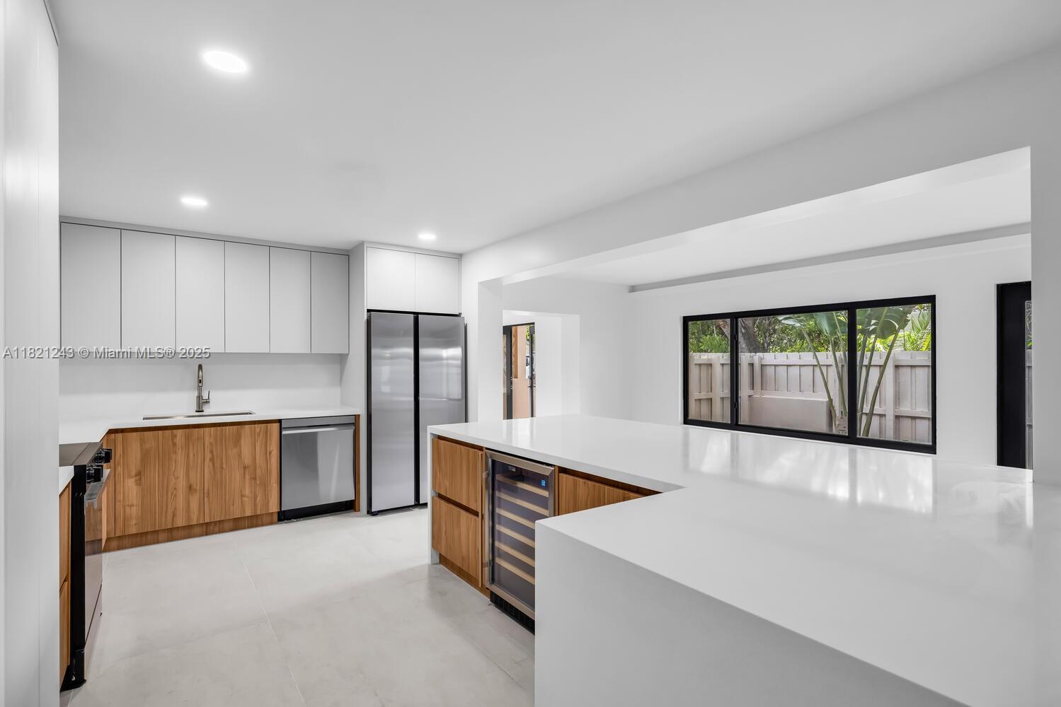 Wow! The 'best of both worlds'...EASY maintenance, perfect for a busy professional schedules...a slice of paradise -wonderful Miami Shores location(located East of NE 2 Ave.)The ENTIRE HOUSE is brand-new floor to ceiling(elec+plumb+flr+wall+kit+outside),permitted w/architect drawings featuring a custom-built MODERN floorplan!..These OPEN spaces showcase a spacious kitchen w/wine bar in the heart of the home. Bathed in natural light,these Impact windows & doors line the entire east side of this home! Feels like a retreat,w/tall fences & landscaped for privacy. Boasting a TRUE 'outdoor living room',accessible from all entertaining areas. Split bedrooms & the Primary suite also faces + opens to outdoor living areas. Both baths are tastefully done w/Beautiful finishes