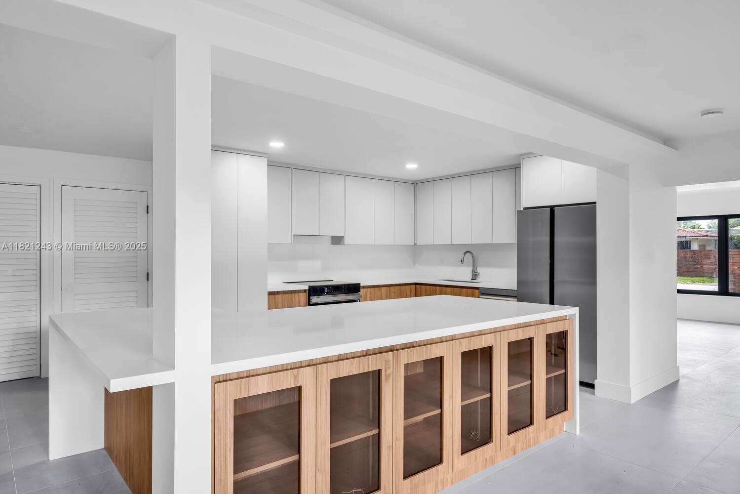 Wow! The 'best of both worlds'...EASY maintenance, perfect for a busy professional schedules...a slice of paradise -wonderful Miami Shores location (located East of NE 2 Ave.) The ENTIRE HOUSE is brand-new floor to ceiling (elec+plumb+flr+wall+kit+outside), permitted w/architect drawings featuring a custom-built MODERN floorplan!..These OPEN spaces showcase a spacious kitchen w/wine bar in the heart of the home. Bathed in natural light, these Impact windows & doors line the entire east side of this home! Feels like a retreat, w/tall fences & landscaped for privacy. Boasting a TRUE 'outdoor living room', accessible from all entertaining areas. Split bedrooms & the Primary suite also faces + opens to outdoor living areas. Both baths are tastefully done w/Beautiful finishes
