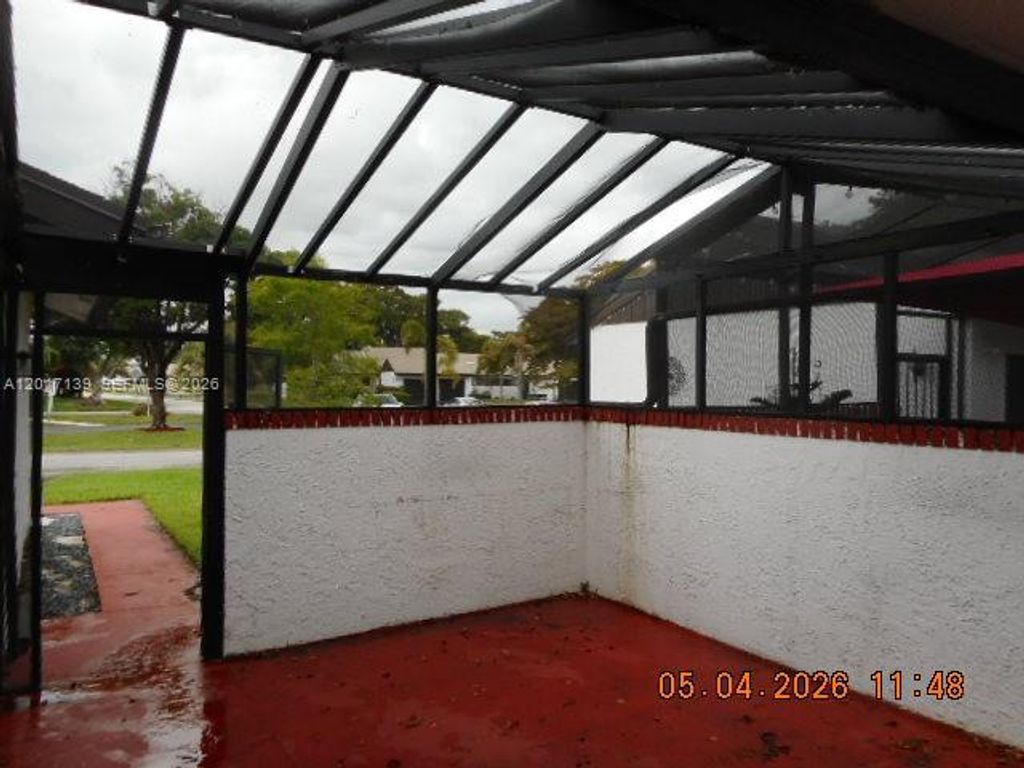 Photo of 6388 E Pinehurst Cir E #C30, Tamarac, FL 33321 (MLS # A12017139)