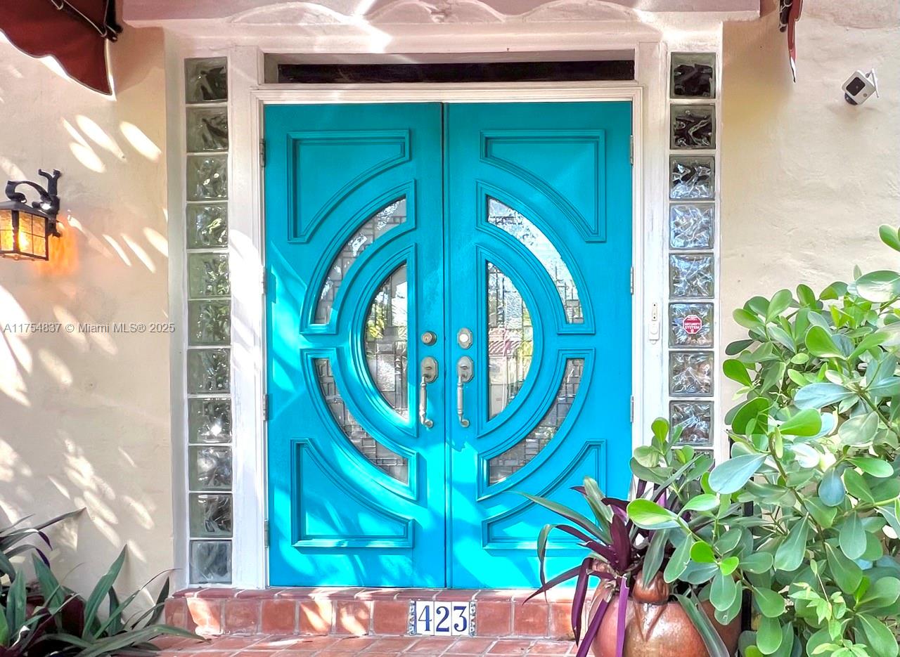 Stunning Old Spanish home on historic Alcazar Ave! This charming boasts 3 bedrooms, 2 bathrooms in the main house + a Cottage Guesthouse with a full bathroom. The Residence sits on a spacious 10,000 sq.ft lot, offering generous living spaces throughout the family room, living room, and dining room. Well-preserved original Cuban tile floors, a cozy fireplace, and a cracked tile foyer add to its timeless appeal. The home retains its character with oak floors and a striking pecky cypress ceiling. A renovated kitchen, dual-zone A/C, and an inviting, well-distributed floor plan make it perfect for entertaining. 20x40 Heated Pool. Currently painted in white interior.