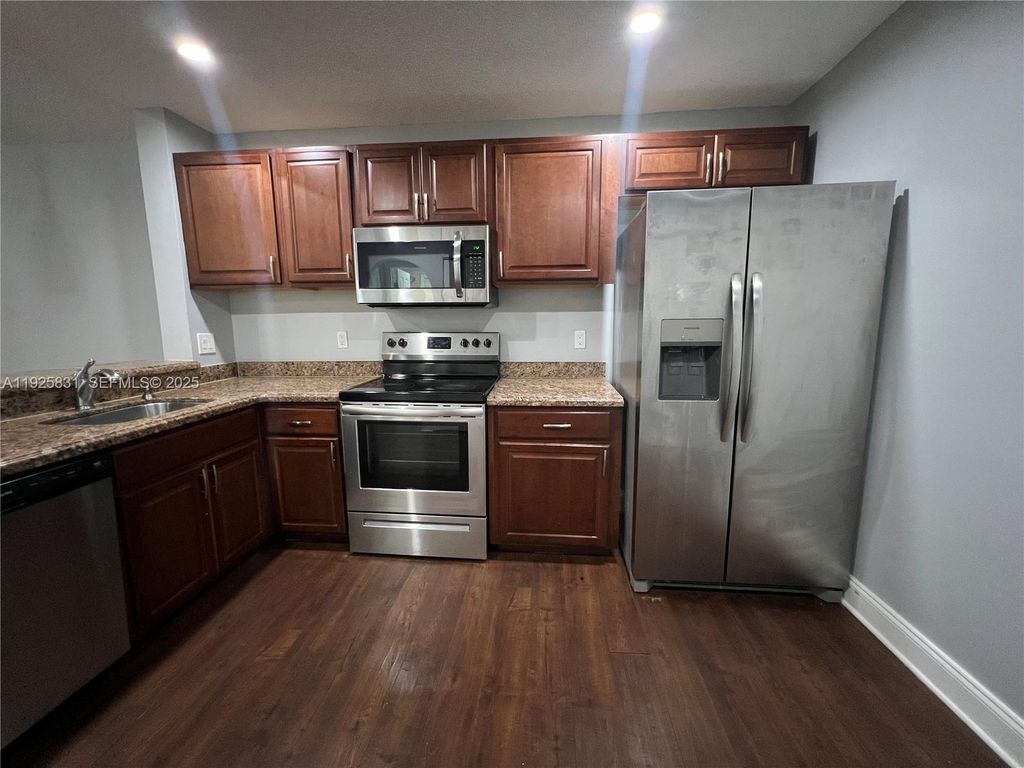 Photo of 5621 Riverside Dr #203A1, Coral Springs, FL 33067 (MLS # A11925831)