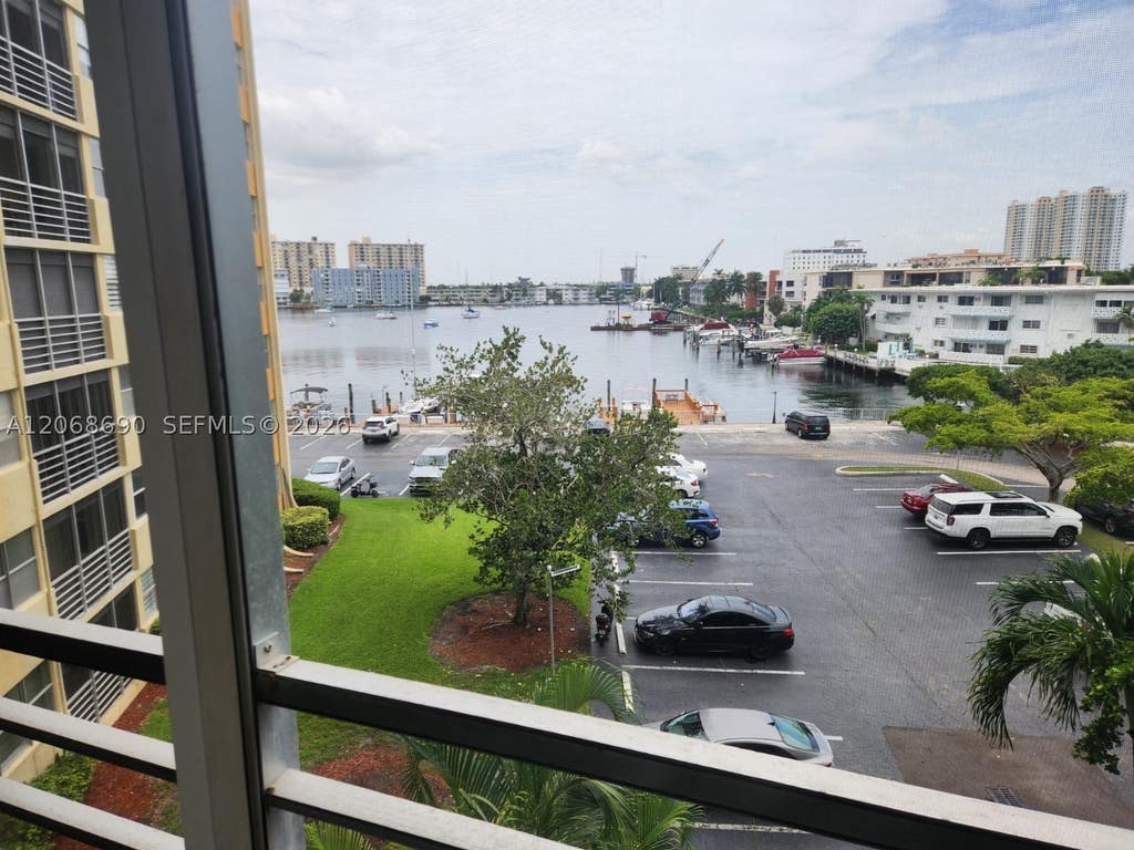 Photo of 100 Golden Isles Dr #409, Hallandale Beach, FL 33009 (MLS # A12068690)