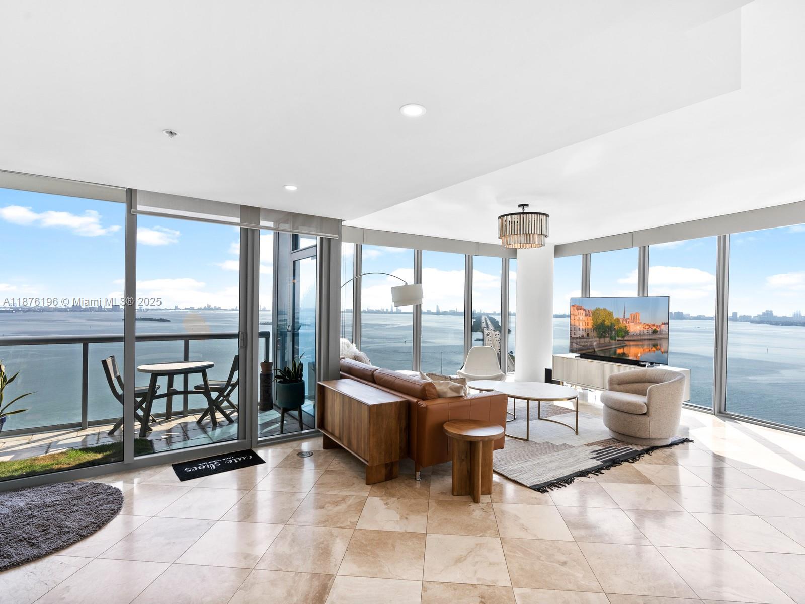 Set on a rare high floor, Unit 2312 captures 180 degrees of unobstructed water views. The floor-to-ceiling windows allow natural light to pour across every inch of the home. The effortless flow between living, dining, and entertaining areas make the home expansive and inviting. Renovated bathrooms throughout feature clean, modern finishes. The primary suite is designed as its own private retreat, complete with a walk-in closet and massive en suite bathroom. Every detail of the unit emphasizes comfort and livability, maximizing space and modern style. The building's resort-style amenities include multiple pools, fitness center, spa, and social spaces. The location puts you just minutes from the the Design District, Miami Beach, and Brickell/Downtown, and a park around the corner.