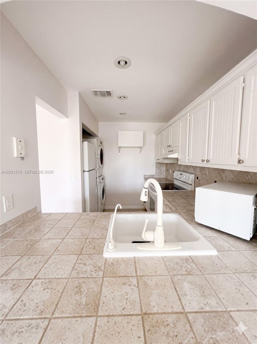 Photo of 10046 Winding Lake Rd #204, Sunrise, FL 33351 (MLS # A12021376)