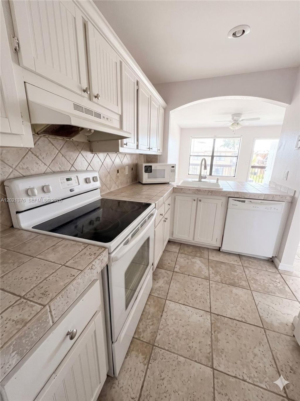Photo of 10046 Winding Lake Rd #204, Sunrise, FL 33351 (MLS # A12021376)