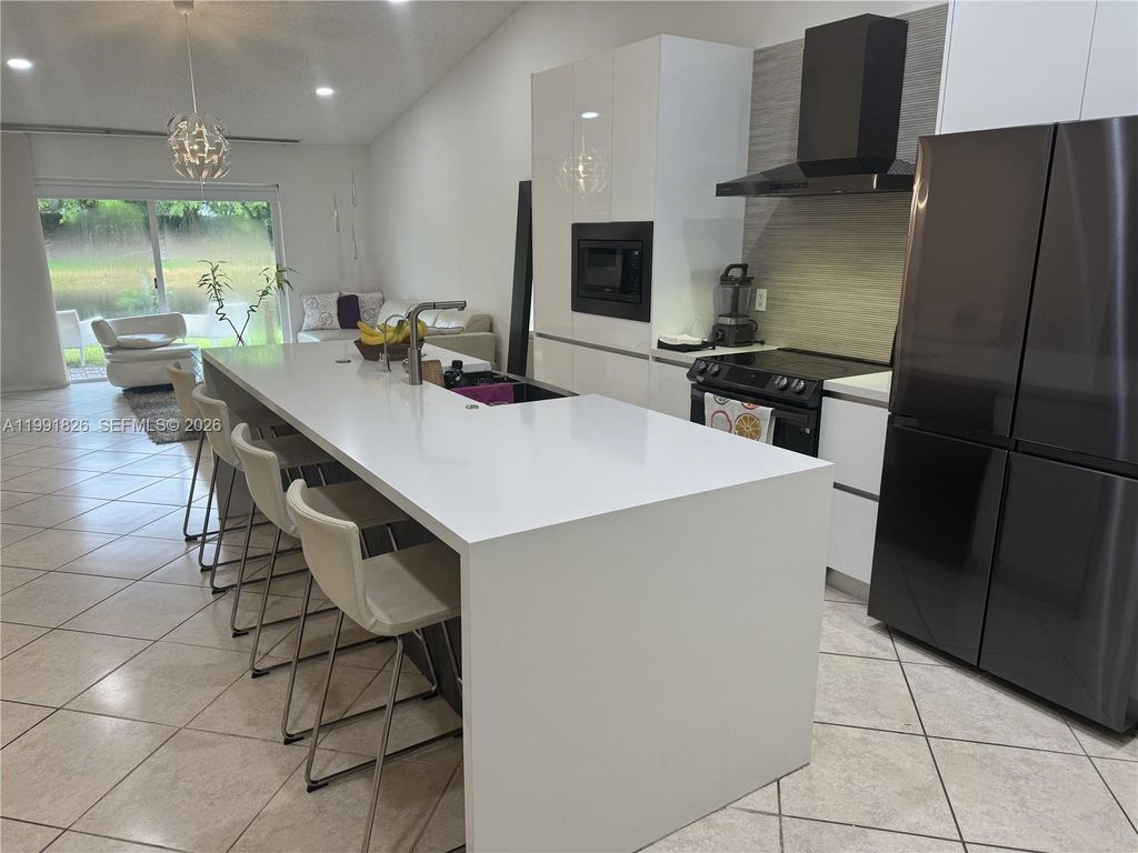 Photo of 2002 Andromeda Ln, Weston, FL 33327 (MLS # A11991826)