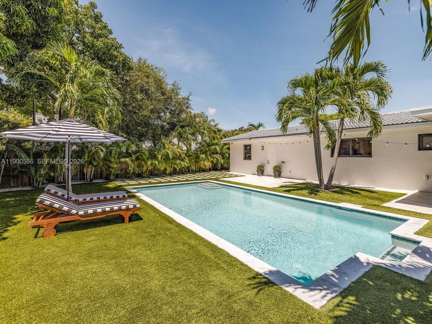 Tucked away behind a stately privacy hedge is Biscayne Park’s best kept secret— a just-renovated midcentury pool home retreat, dripping in high-end, luxe modern design. Welcome to Silver Palms! Enjoy fantastic resort-style living, complete with: open-flow living and dining; bright new eat-in quartzite waterfall kitchen with coffee station and high-end appliances; wide plank light oak wood floors; two double en-suite primary bedrooms; new modern designer baths; custom wood-slat paneling details; updated electrical, lighting, water heater, impact windows-doors; and premier tropical rear gardens with 30’x15' chilled-heated lap pool, Trex and porcelain decks, premium turf grass, and a beautiful screened-in porch. All with a spacious conversion-ready two-car garage and plenty of guest parking.