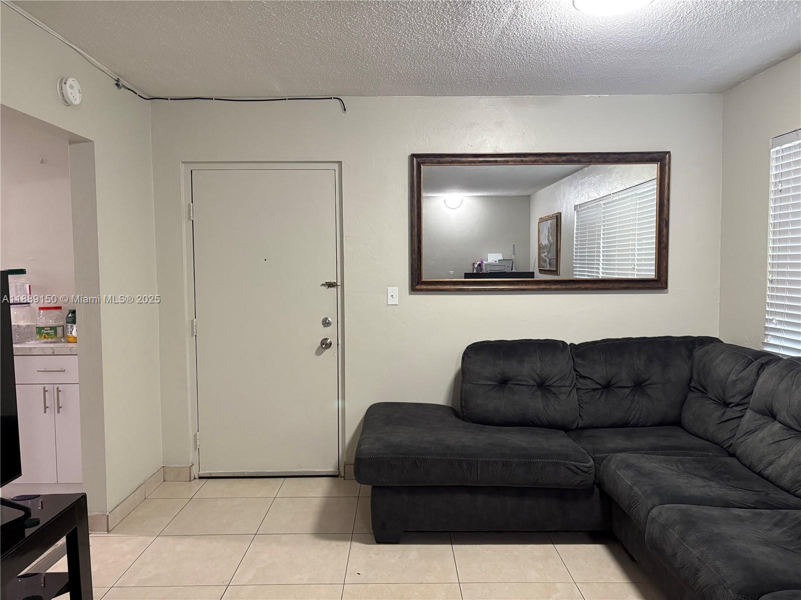 Beautifully remodeled 2-bed/2-bath apartment in West Hialeah, just steps from the Amelia District! Features include brand-new appliances, laminated wood floors, porcelain tile in both bathrooms, and impact windows. Just 20 ft from the laundry room with 2 washers & dryers. Includes 1 assigned parking space plus plenty of guest parking. Enjoy free access to the pool, BBQ area, and clubhouse. Gated garage closes at 7 PM and is accessible only by residents. Move-in ready—schedule your visit today! Cash buyers or purchasers with a minimum 30% down payment only. Please note: This building does not have reserve funds.