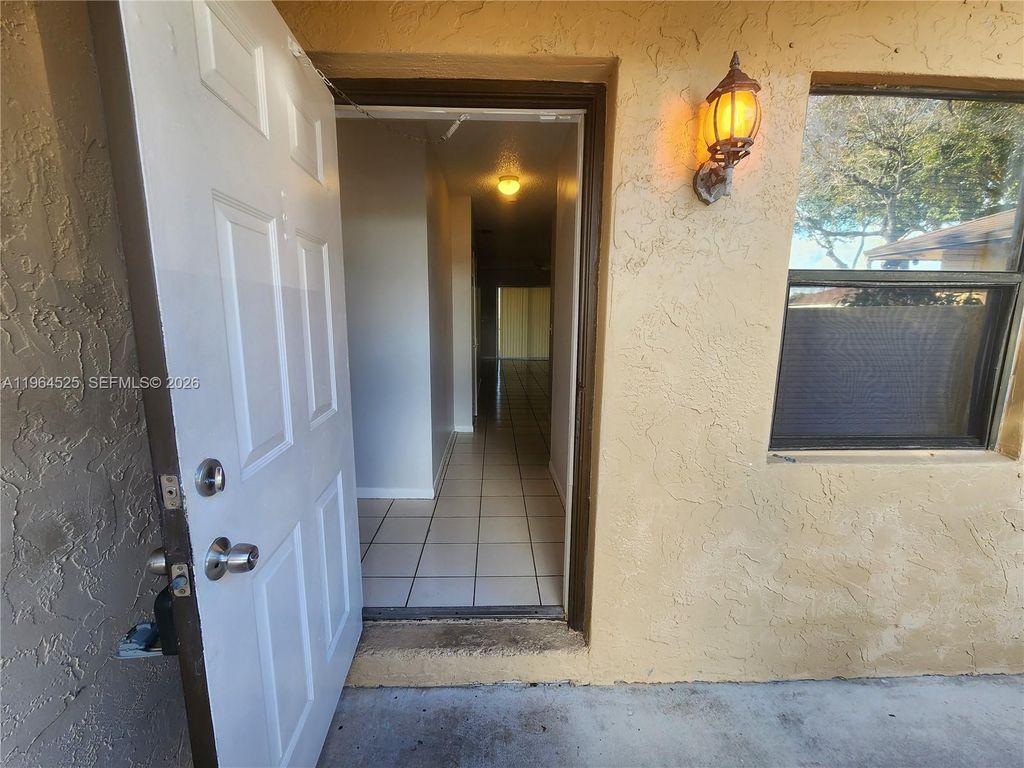 Photo of 10967 NW 30th Pl #A, Sunrise, FL 33322 (MLS # A11964525)