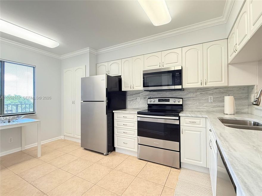 AS-IS corner unit, ready to move in, 2 beds, 2 baths, unit offers closets and walking closet distributed around the unit and bedrooms. Unit can be sold furnished or unfurnished. Remodeled Kitchen with countertop, and isle. Tile floor. Unit has inside laundry full size washer and dryer. Location is one of the advantages. Close to highways, like I-95, few miles away from the beach and several shop centers and restaurants, casino, racetrack and more. Condo offers pools, gym, tennis court. Owner motivated and easy to show. Schedule it by showing assist. Lockbox on site.