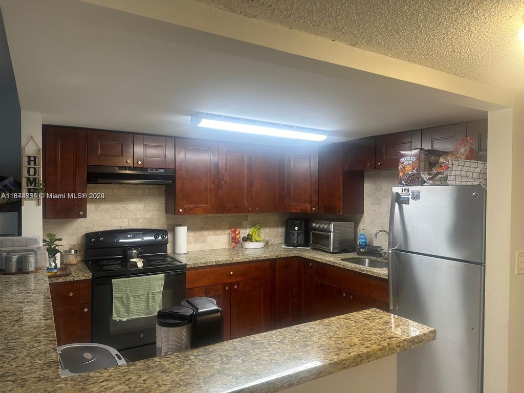 Photo of 11131 Royal Palm Blvd #8, Coral Springs, FL 33065 (MLS # A11874954)