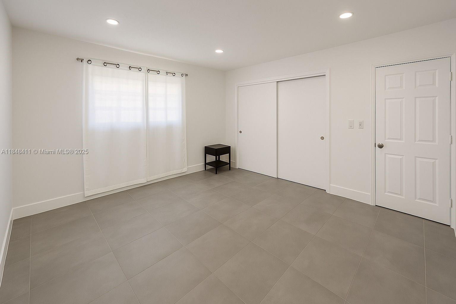 Bright and freshly updated 1 bed/ 1 bath unit in the heart of Little River. This space features clean lines, modern tile flooring, recessed lighting, and a split A/C unit for comfort. Natural light filters through , giving the unit a soft, airy feel. You're just 3 blocks from Biscayne Blvd, with easy access to local favorites like The Citadel food hall, Legion Park, and the MIMo District. plus a short drive to Wynwood, the Beach, & Brickell.This unit offers a seamless rental experience with NO HOA approval required, making move-in fast and hassle-free. The building features just 8 units across two stories, offering a quiet, community-oriented feel. The unit is thoughtfully laid out and ideal for tenants seeking convenience, privacy, and proximity to Biscayne Blvd, local shops, and transit.