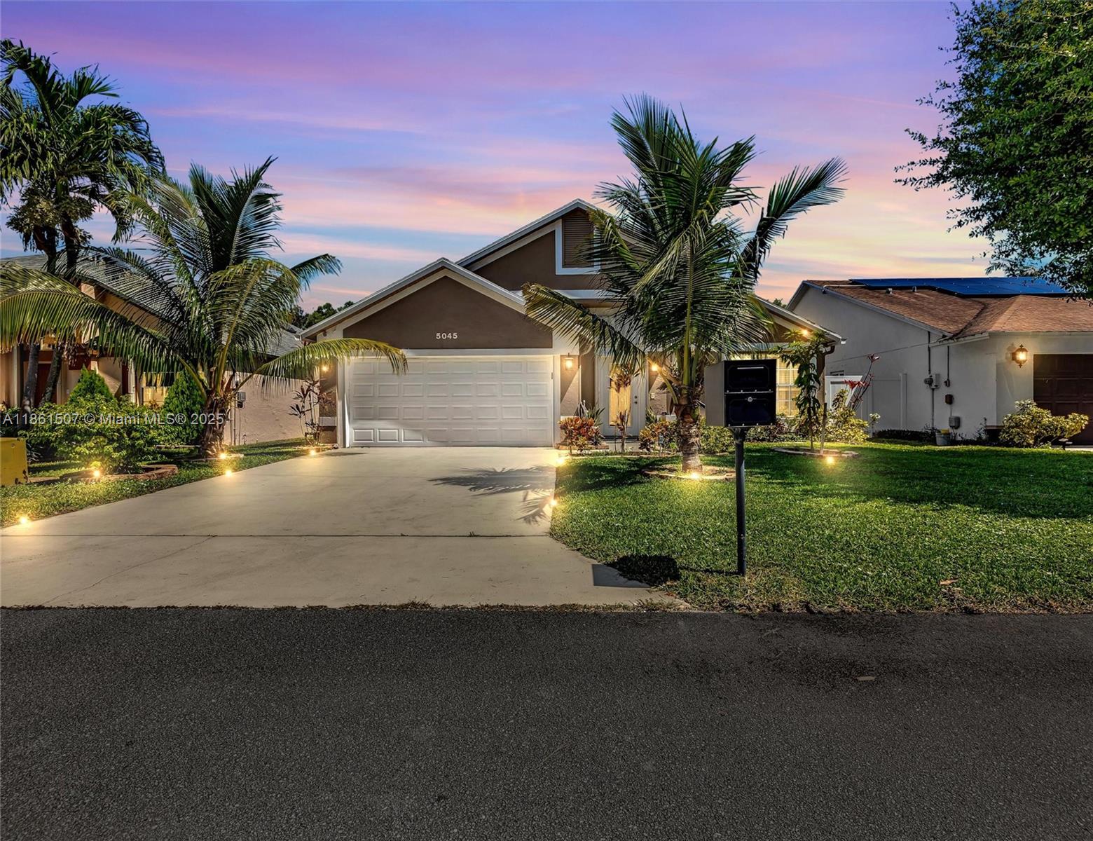 Charming 3BR/2BA/2CG home nestled in the desirable gated community of Foxhall. This bright and spacious residence features vaulted ceilings, an open-concept design, and modern tile floors throughout. The remodeled kitchen offers granite countertops, wood cabinetry, and a center island, while both bathrooms have been tastefully updated. Enjoy large bedrooms with custom closets, no popcorn ceilings, and a private screened patio overlooking a lush backyard with fruit trees perfect for gatherings and outdoor living. Recent upgrades include new kitchen and baths, new tile floors, fresh interior/exterior paint, new vinyl fence and Accordion shutters. Low HOA includes cable, internet, community pool, cabana, and tot lot. Prime location near Airport, I-95, Turnpike, beaches, shopping. A must see!