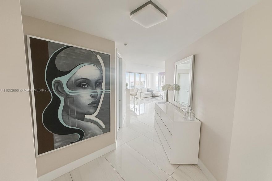 Stunning 3-bed/3.5-bath luxury residence in Parque Towers, Sunny Isles Beach.
Experience expansive coastal living with ~2,400 sq ft of beautifully designed interiors, floor-to-ceiling windows, and a wrap-around balcony that captures panoramic ocean, skyline, and Intracoastal views. The open layout flows through a gourmet kitchen with a central island and premium finishes into an elegant living/dining area — ideal for entertaining. Each bedroom offers its own en-suite bathroom for privacy and comfort. Residents enjoy full resort-style amenities: concierge, spa, fitness center, pool, and more, all steps from pristine beaches, upscale dining, and the best of Aventura & Bal Harbour. A rare modern gem in the heart of Sunny Isles.