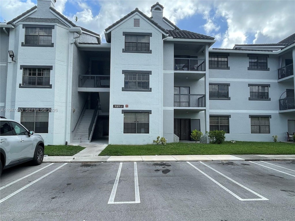 Photo of 11211 W Atlantic Blvd #202, Coral Springs, FL 33071 (MLS # A11947483)