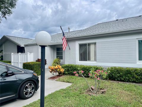 Photo of 8633 Sunbird Pl, Boca Raton, FL 33496 (MLS # A11870909)