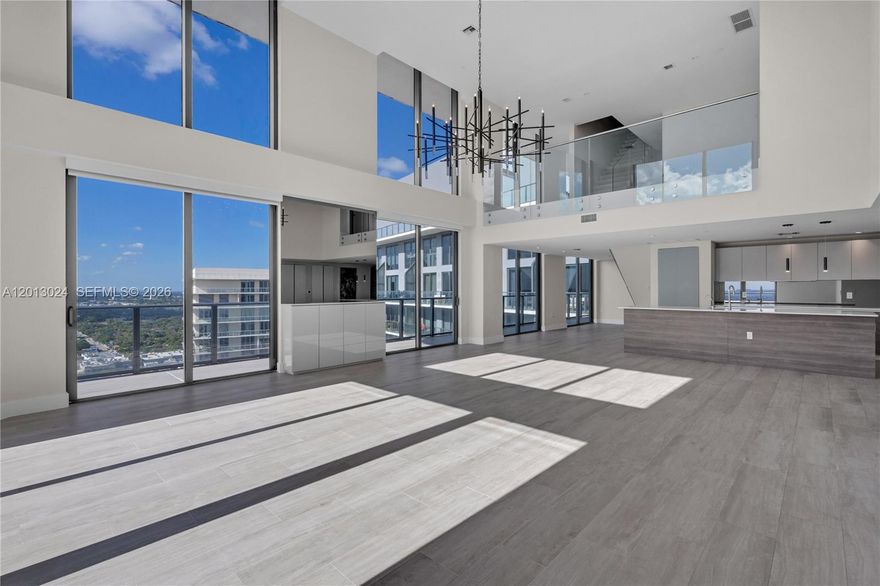 Triplex Penthouse in Midtown Miami's Hyde Residences. Featuring 4 beds, 4.5 baths with panoramic city views, PH3217 includes 3 parking spaces: 2 deeded spots located side-by-side, plus 1 valet parking space and 2 PRIVATE STORAGE ROOMS. Property features an impressive abundance of natural light streaming in through its expansive two-story, ground-to-ceiling windows, offering stunning skyline views at night. The 1st floor includes 2 luxurious en-suite bedrooms, a chef's kitchen, and a powder room. The 3rd floor ROOFTOP RETREAT hosts a SKY KITCHEN and its very-own PRIVATE JACUZZI, perfect for relaxation & entertainment.