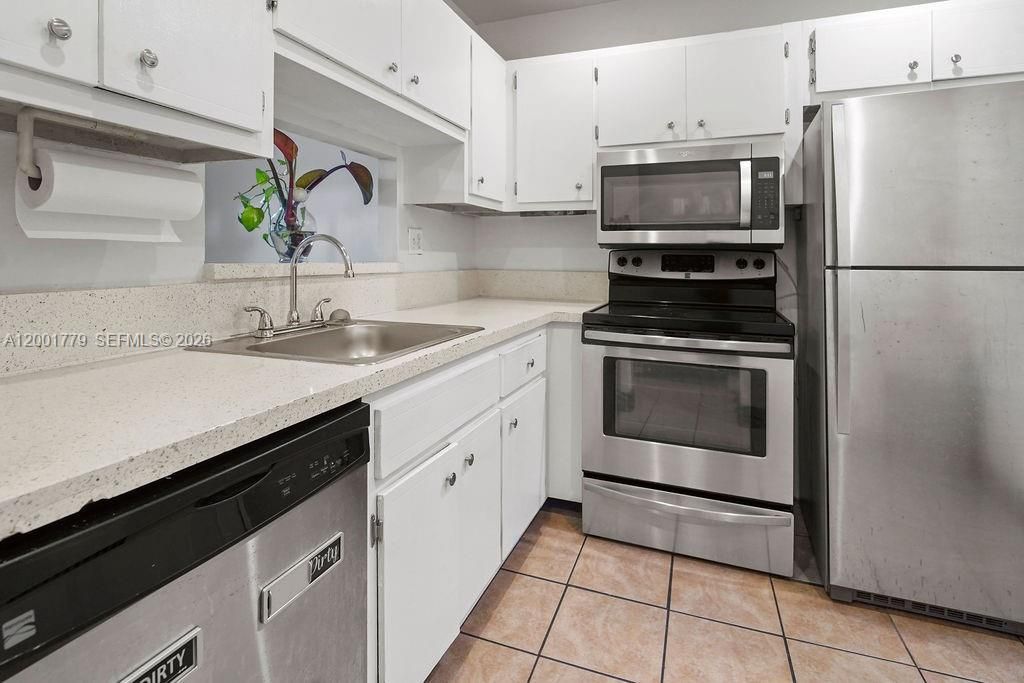 Photo of 5121 W Oakland Park Blvd #109, Lauderdale Lakes, FL 33313 (MLS # A12001779)