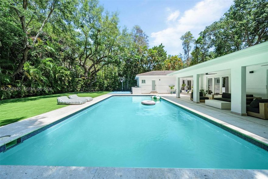 Discover an exceptional opportunity in the heart of Coral Gables' coveted Platinum Triangle. Set on a rare double lot of nearly 1/3 acre, this 3BR/3BA residence offers nearly 2,900 sqft of refined living, surrounded by lush tropical landscaping.
A spacious driveway and attached garage offer generous parking, storage, and standout Coral Gables curb appeal.
The resort-style backyard is the showstopper: a stunning 40-foot pool, private basketball court, fully equipped outdoor kitchen, expansive covered terrace, and elegant pergola, built for Miami's signature indoor-outdoor lifestyle. You will love to entertain in this house!
Inside, a beautifully renovated family room (Potential 4th bedroom) delivers warmth, designer finishes, and timeless elegance. Rich wood flooring runs seamlessly throughout, adding warmth, character, and refined luxury to every room. 3 spacious bedrooms and light-filled living areas make this Coral Gables pool home truly move-in ready, with a primary suite that offers exciting potential to customize and make your own.
The rare double-lot footprint offers a unique chance to expand, build new, or customize, a generational asset in Coral Gables' most prestigious enclave.
Minutes away from top-rated public and private schools including Sunset Elementary, Gulliver Prep, Carrollton, Ransom and Riviera, and very close to the Sunset Place, Coconut Grove and the marina.
A true gem in one of the best parts of Coral Gables. Schedule your private showing today.