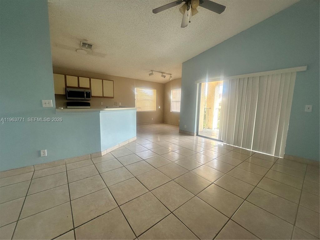 Photo of 9999 Summerbreeze Dr #315, Sunrise, FL 33322 (MLS # A11963771)