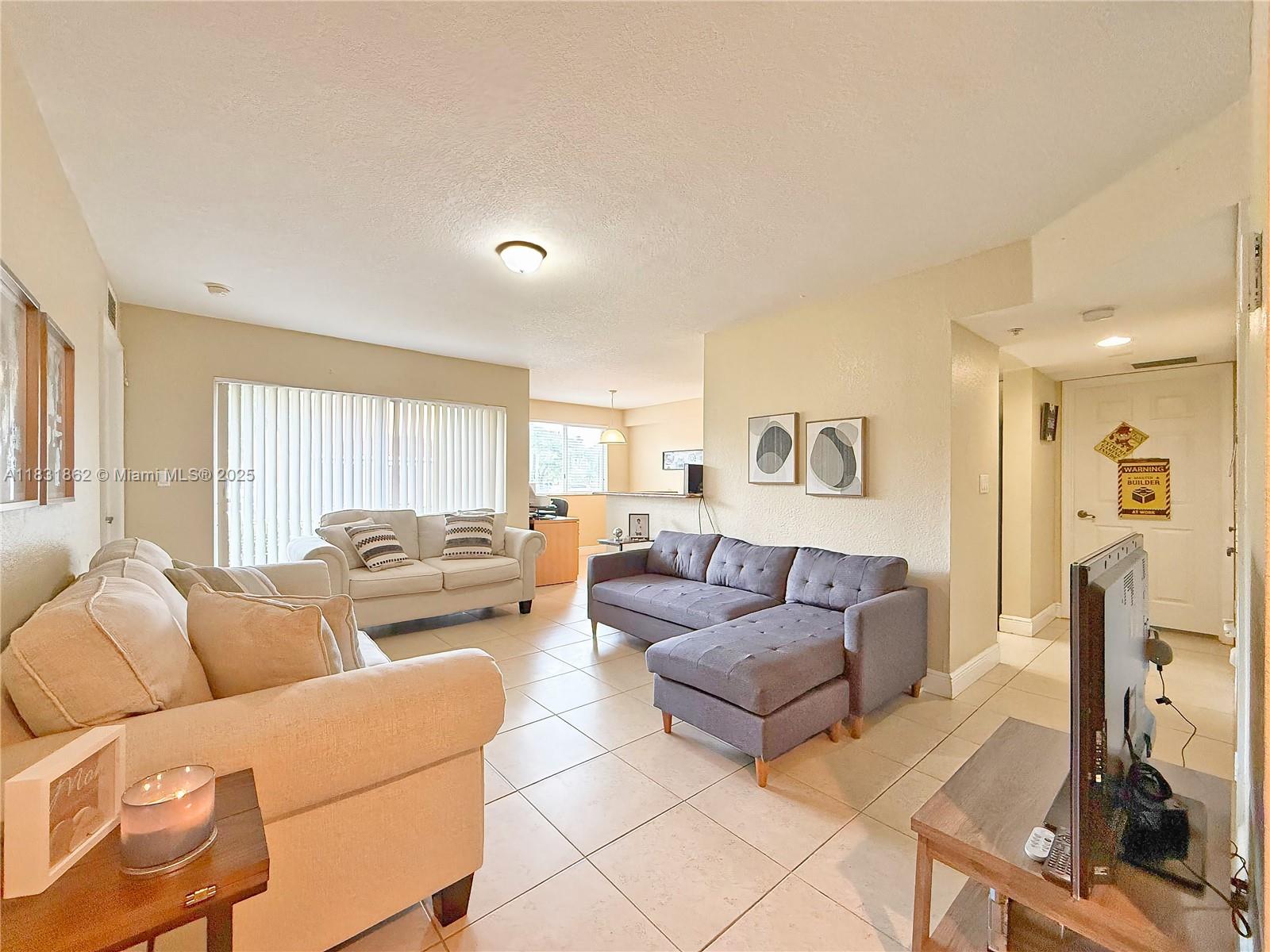Spacious 2-Bedroom, 2-Bathroom Condo – 991 Sq. Ft. with Extra Storage & Parking!
This well-maintained 2-bedroom, 2-bathroom condominium offers 991 square feet of bright, open living space. in-unit washer and dryer, and impact-resistant windows for added safety and comfort.
Enjoy your morning coffee or evening breeze from the open balcony, and appreciate the ease of daily living with two assigned parking spaces and an additional storage area — perfect for bikes, seasonal items, or extra belongings.
Take advantage of a low 3% down payment with a conventional loan! Ideally situated just minutes from Black Point Marina, with easy access to scenic jogging and biking paths along Old Cutler Road and 87th Avenue. Retail, grocery stores, and excellent schools are all nearby.