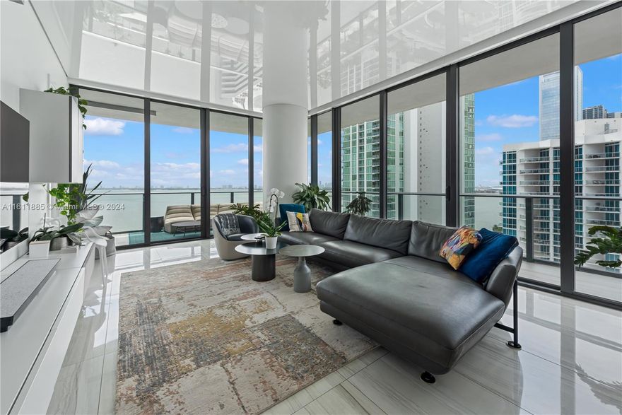 Introducing a truly magnificent and elegant corner unit at Gran Paraiso, offering breathtaking bay and ocean views, complemented by the enchanting cityscape at night. This 5-bedroom, 6.5-bathroom haven boasts wraparound terraces, floor-to-ceiling windows, inviting natural light, and panoramic views. With arrival via private elevator access to 10 foot high ceilings and an open concept floor plan, this residence exudes an air of spaciousness and sophistication. The beautiful Italian kitchen design features high-end appliances including a Sub-Zero refrigerator and velum ceiling with parameter lights. Resort lifestyle, with access to a spa, state-of-the-art fitness center, bowling alley, tennis court, putting green and multiple pools.