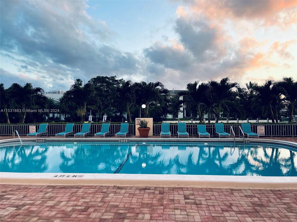 Photo of 401 Golden Isles Dr #903, Hallandale Beach, FL 33009 (MLS # A11531883)