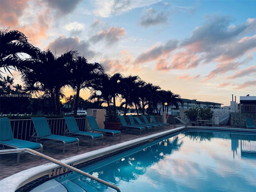 Photo of 401 Golden Isles Dr #903, Hallandale Beach, FL 33009 (MLS # A11531883)