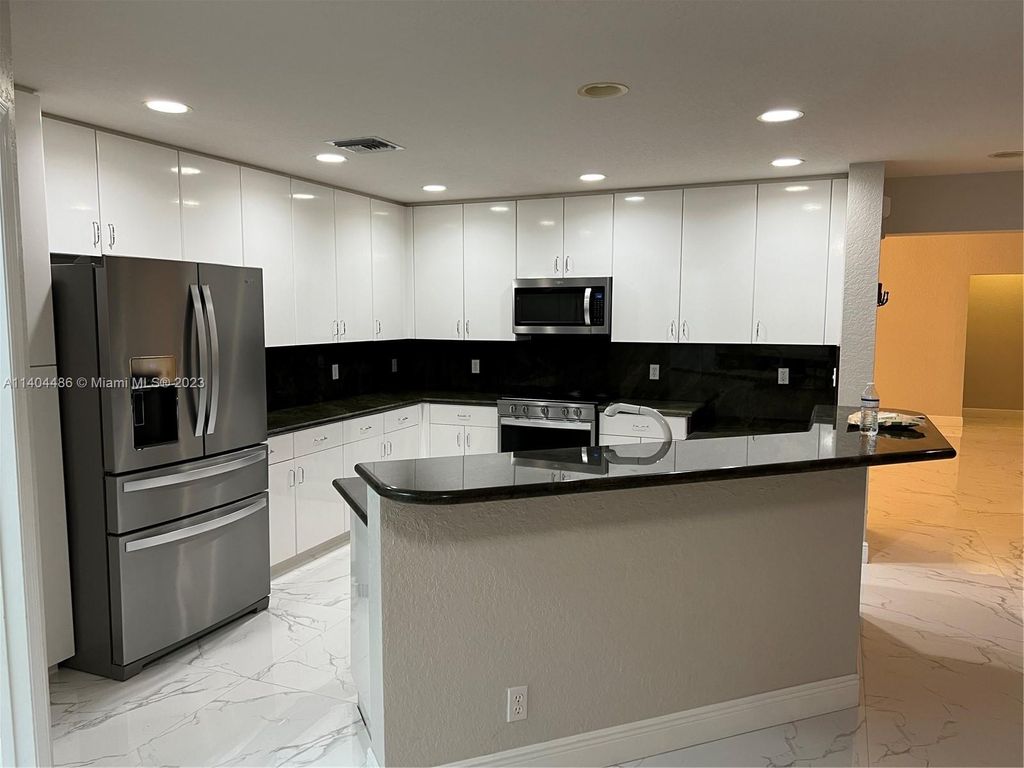 Photo of 13756 NW 21st St, Pembroke Pines, FL 33028 (MLS # A11404486)