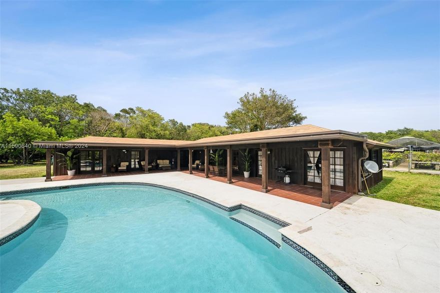 LOCATION! Looking for something unlike any other property in the Redland area? This unique gem is surrounded by state owned land known as Castellow Hammock Preserve. No neighbors, no developers. A secluded oasis on 5 acres w/ 2 dwellings. Front 2.5 acres host the primary 1,381 sq ft 1/1 built 1953 and the guest house 2,133 sq ft 3/2.5 built 2000 w/ attached oversized office (which could be a fourth bedroom). 18'X40' pool that is 9' deep. New: roofs, 3 new A/C units, new hot water heaters, primary all new plumbing, new pool pump, fresh paint. Concrete outbuilding for additional storage. Rear 2.5 acres has a private entrance and leased to 2 organic farmers. Ag Exempt with irrigation, nursery hoop house. RV hook-up. Endless potential for this Must See!