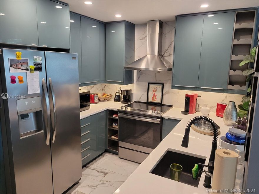 Check with your lender! Building may qualify for reduced down payment! Luxury and the feeling of home hit you simultaneously as you enter this totally renovated, gorgeous one bedroom, one and a half bath escape.  Move in ready.  Stainless Steel appliances shine even brighter against the blue modern cabinetry.  Double entry to the bedroom suite bring you to an oasis of comfort with adjacent balcony. VIRTUAL TOUR IS ATTACHED.

Additional features include, impact windows, hurricane shutter on patio, secured parking, recently remodeled corridors, lobby and elevators, and amenities that include pool, sauna, BBQs, gym, party room, 12 space dock and 24 hours security.  Minutes to beach, shopping and restaurants.  This property is not to be missed, see it today.