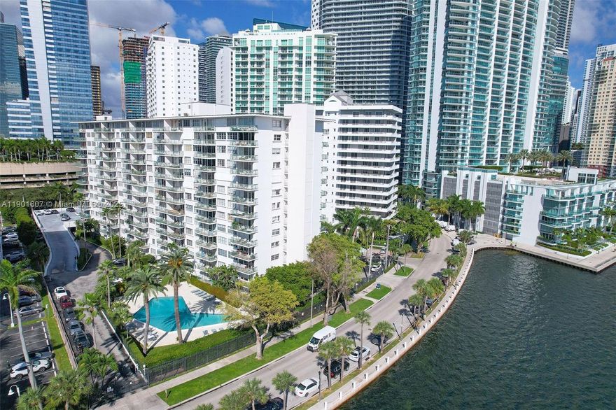 Amazing price! Live the Brickell lifestyle in this waterfront condo overlooking beautiful Biscayne Bay. This spacious 1-bedroom, 1-bath residence offers 787 SF of living space and a large open balcony with stunning bay views. Enjoy abundant natural light, tile floors, great closet space. Kitchen offers ample cabinet and counter space, a dishwasher, electric range, microwave, and fridge. 1 assigned gated parking space, guest parking. Hurricane shutters. The condominium provides hot water and air conditioning, keeping utility costs remarkably low. Amenities include a pool set in a lush garden, a fitness center, on-site management, concierge, and guarded gate.