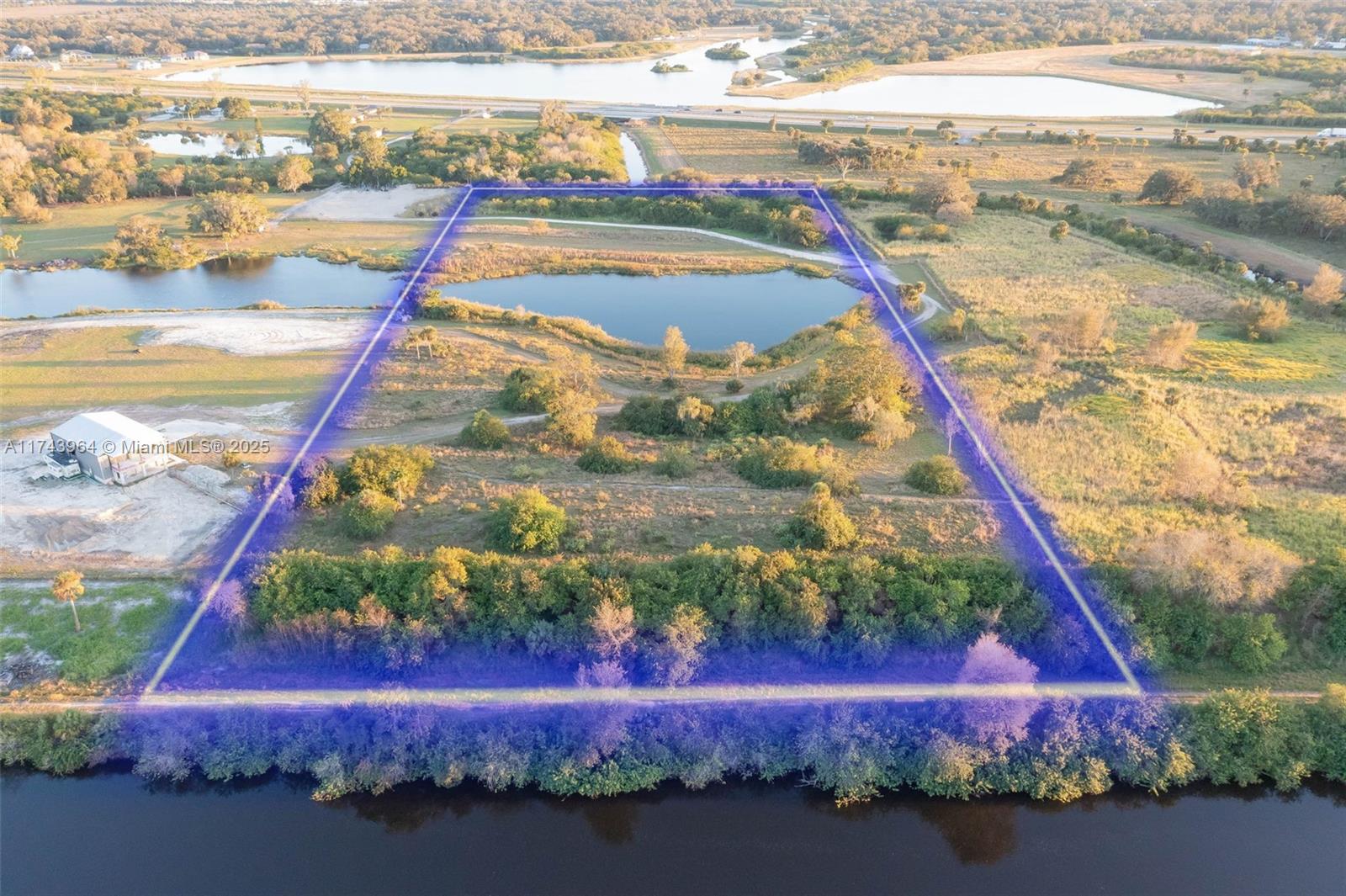 Nestled along the Caloosahatchee River, this stunning 11+ acre property offers over 400 feet of riverfront with sweeping, elevated views of the river and surrounding countryside—an ideal setting to build your dream home. With secluded access via an easement off SR-80, this peaceful retreat is just a few miles east of downtown LaBelle, offering both privacy and convenience. The AG-2 zoning provides incredible flexibility, allowing for the perfect combination of homesteading and recreation. You can start a hobby farm or have plenty of room for a garden or your own recreational paradise, riding horses, fishing on the lake, enjoying the natural beauty that surrounds you. Ample room to park recreational vehicles, boats, or work equipment, ideal for a variety of lifestyle needs.